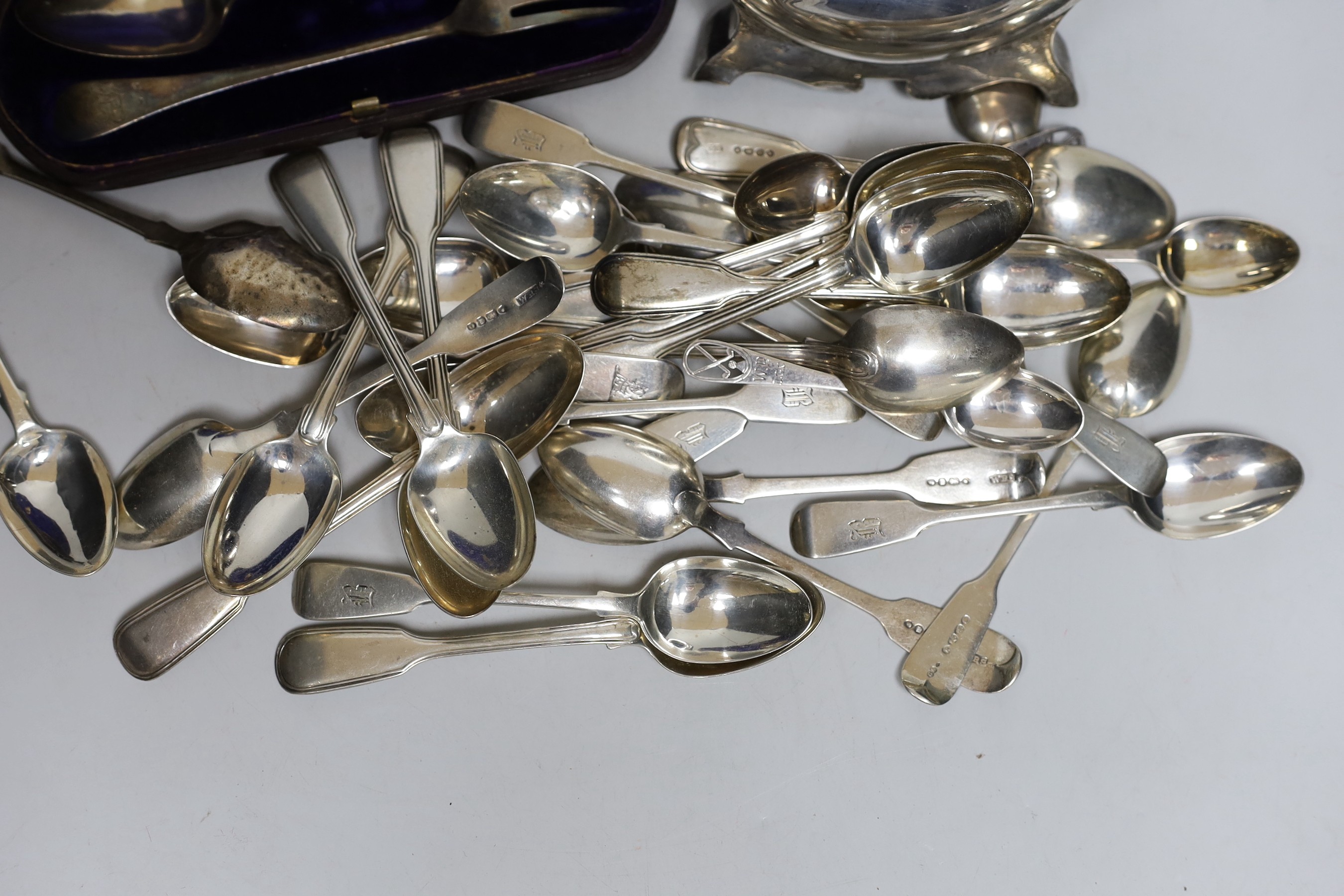 A set of eleven Victorian silver fiddle pattern teaspoons, Elizabeth Eaton, London, 1854/5, assorted other silver teaspoons, various dates and makers, a cased silver christening pair and a silver pocket watch travelling